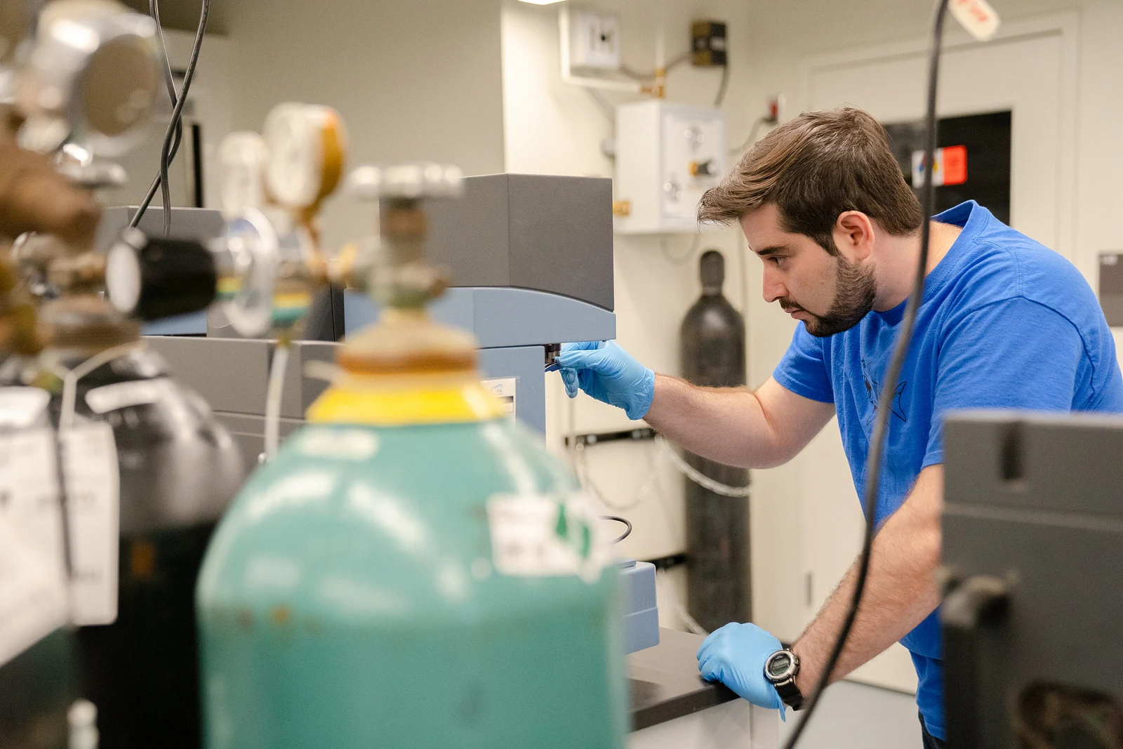 Mohammad Houshmand working with an instrument in the laboratory
